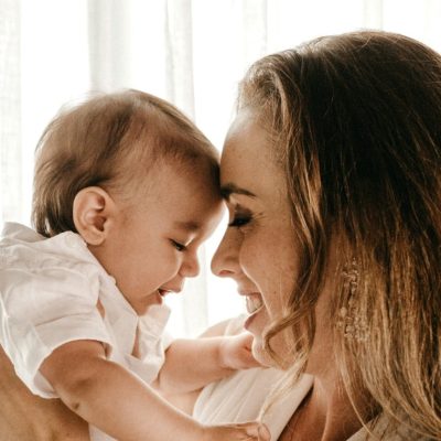 happy mother holding her baby